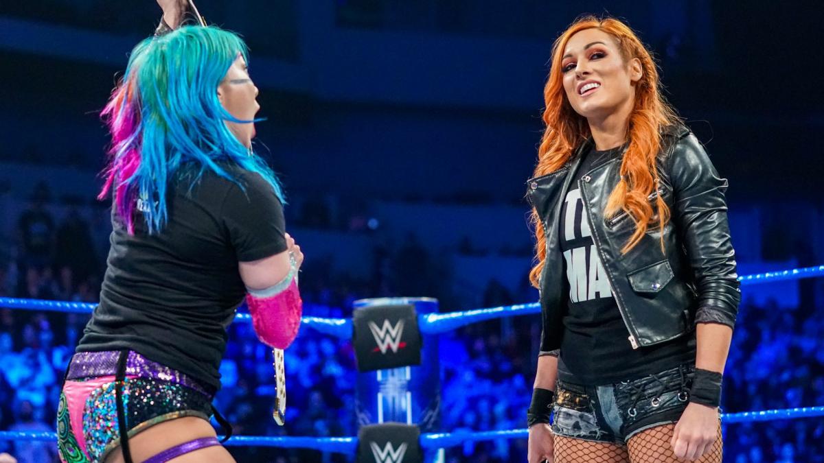 Asuka, Becky Lynch and Charlotte Flair engaged in an intense standoff