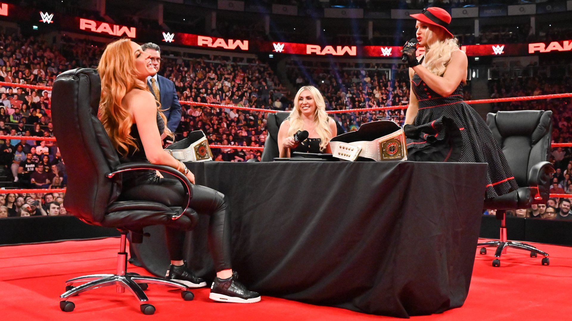 Charlotte Flair and Lacey Evans attacked Becky Lynch during their double contract signing