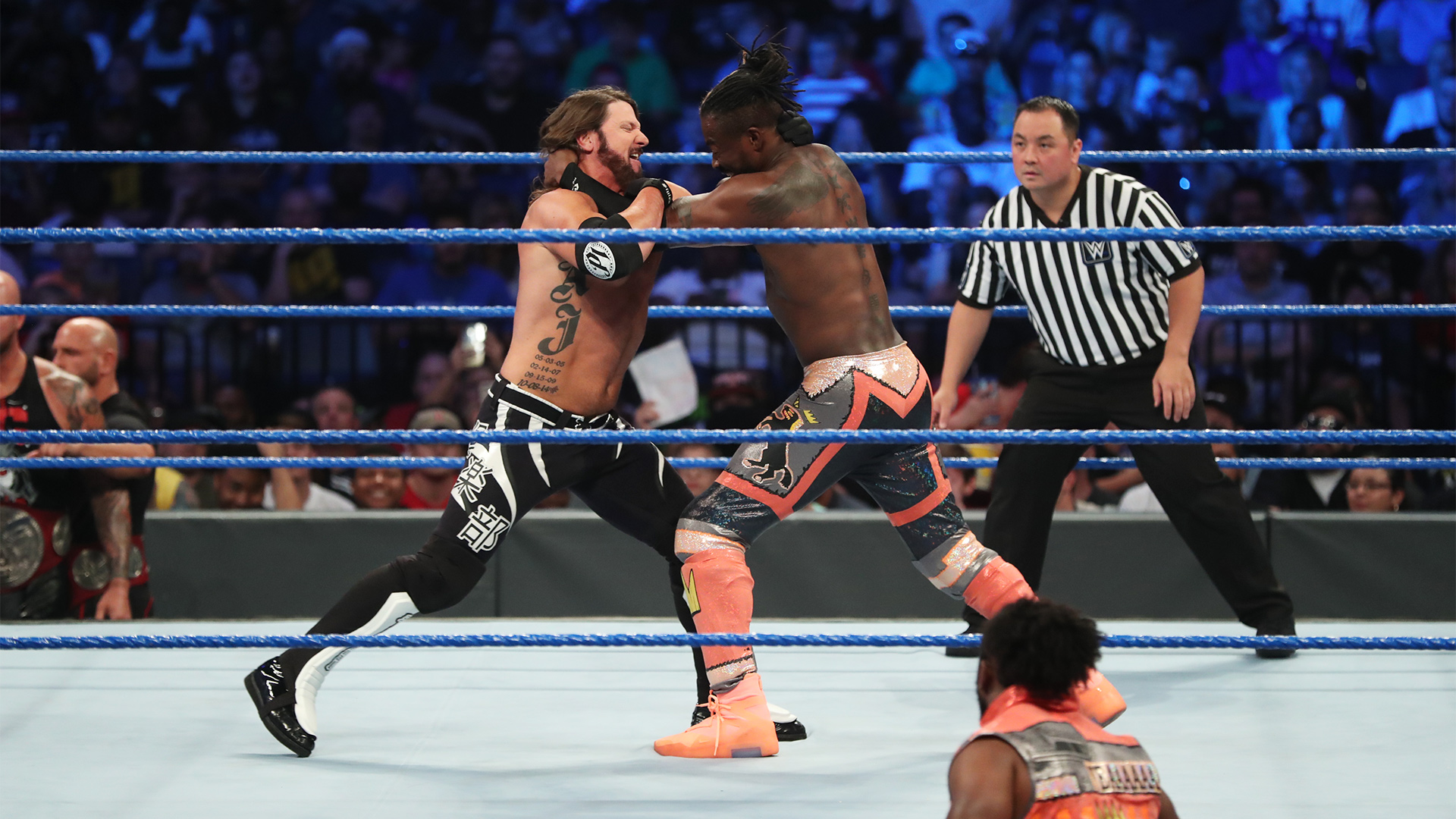 Kofi Kingston def. AJ Styles; Roman Reigns narrowly avoids injury in backstage area