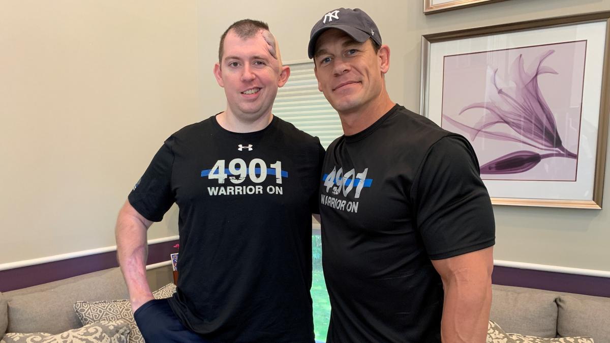 John Cena meets with injured Officer Cem Duzel