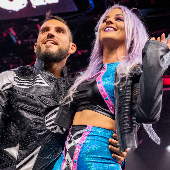 Johnny Gargano, Candice LeRae and their dog Pawdmeâ stage epic gender reveal