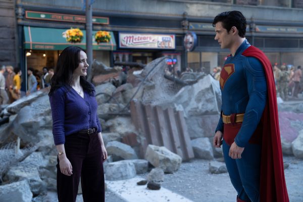 Superman and Lois Lane talking near rubble.