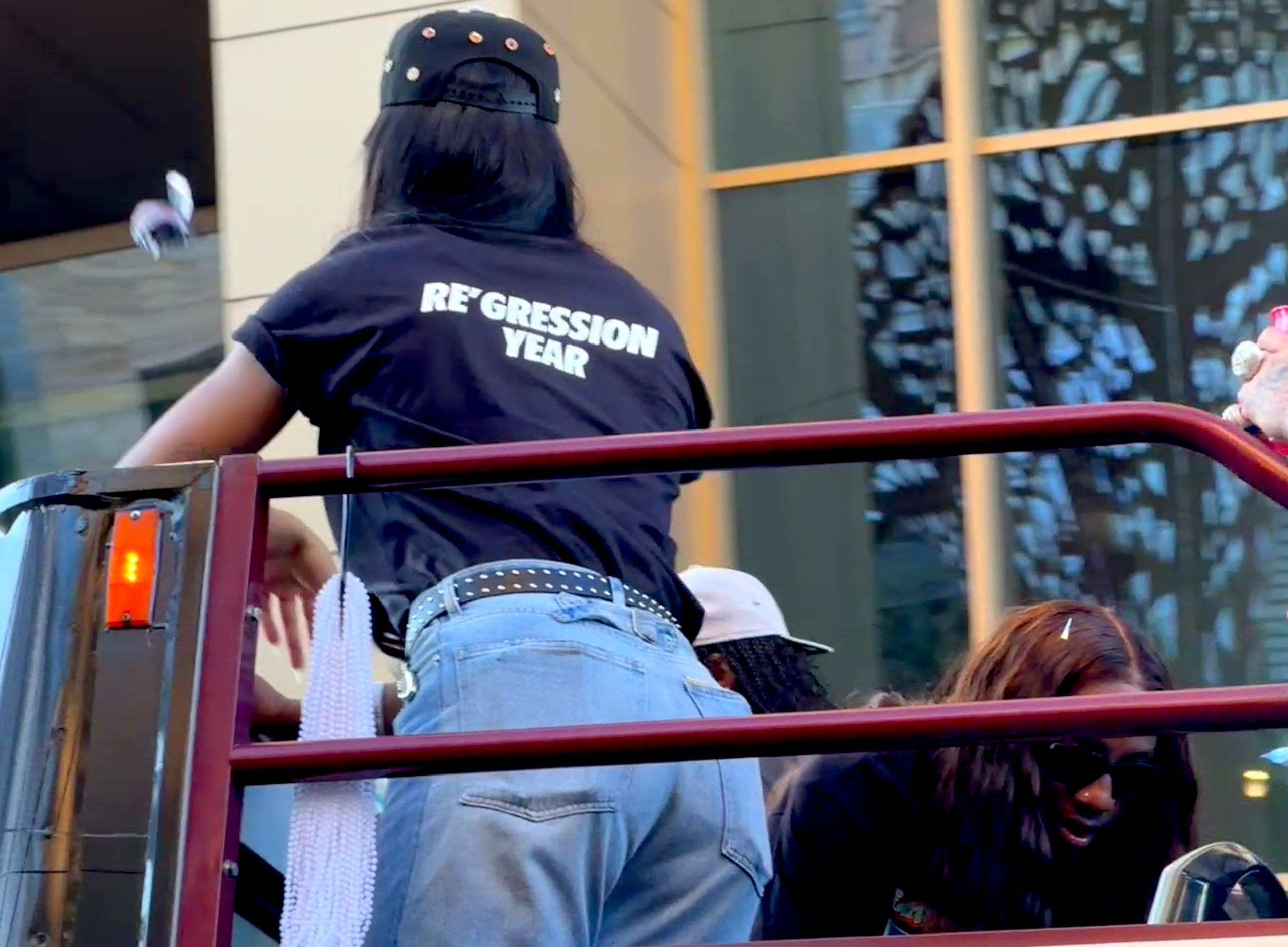 A'ja Wilson clapping back with a "Re'gression Year" shirt in response to critics saying she regressed during the 2025 season.