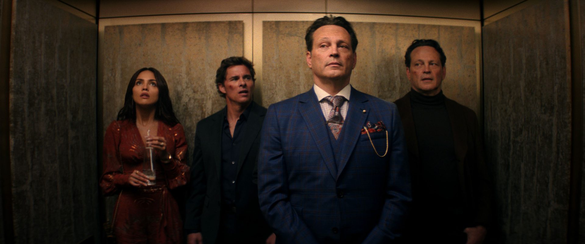 Vince Vaughn playing two versions of his character alongside James Marsden and Eiza González in a stylized action-comedy scene from Mike and Nick and Nick and Alice