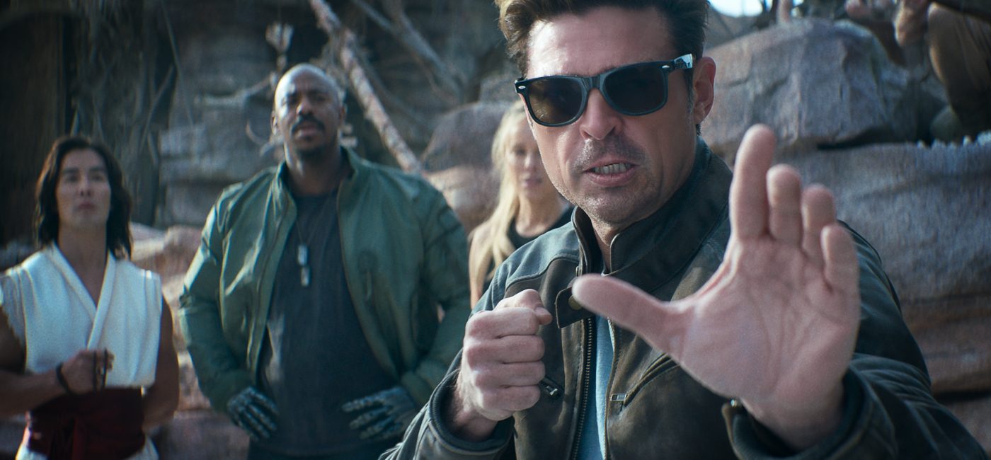 Karl Urban as Johnny Cage in Mortal Kombat II (2026) standing in a combat arena ready for battle with dramatic lighting