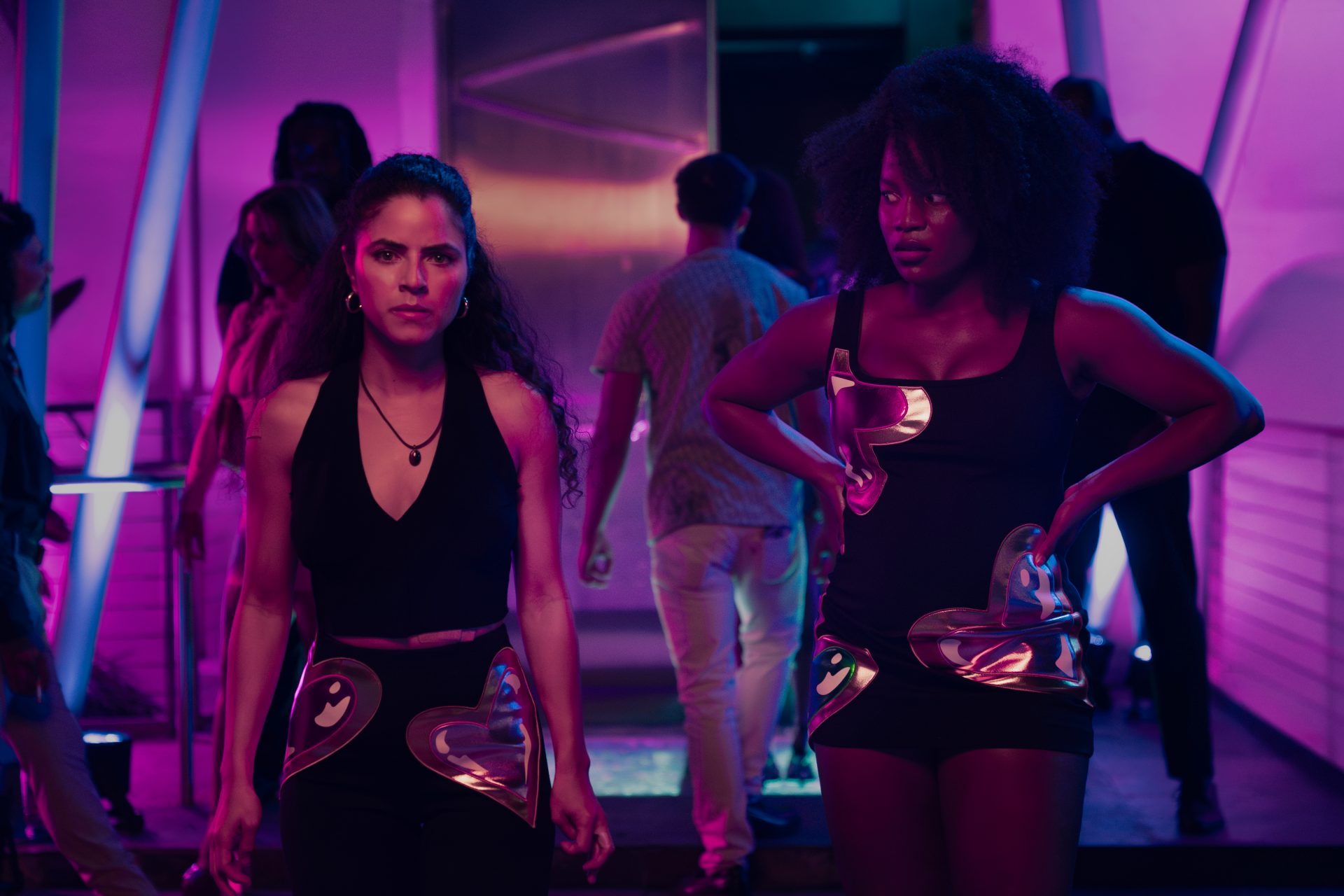 Shannon Gisela as Etta Tiger Jonze & Brittany Adebumola as Lovely in Peacock’s crime thriller series M.I.A.