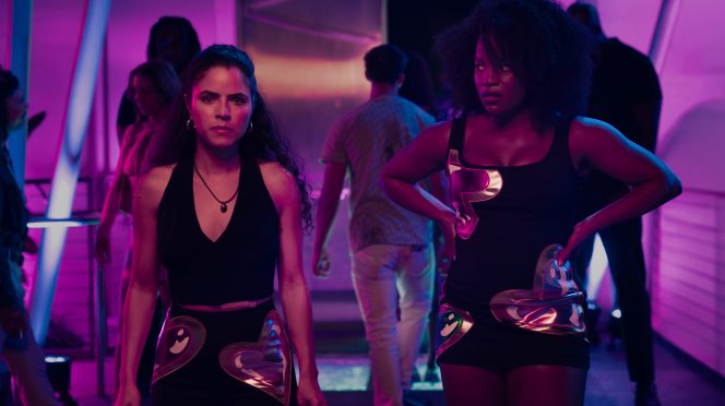 Shannon Gisela as Etta Tiger Jonze & Brittany Adebumola as Lovely in Peacock’s crime thriller series M.I.A.