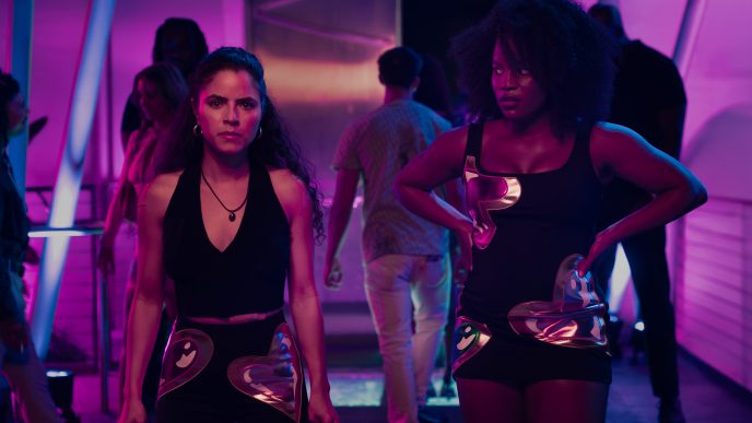 Shannon Gisela as Etta Tiger Jonze & Brittany Adebumola as Lovely in Peacock’s crime thriller series M.I.A.