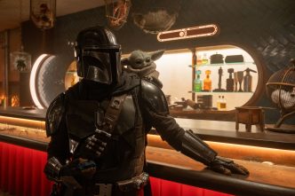 Pedro Pascal as Din Djarin alongside Grogu in Star Wars The Mandalorian and Grogu