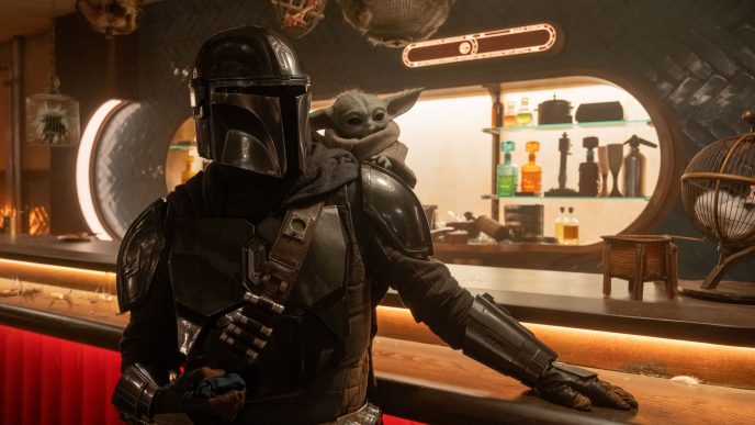 Pedro Pascal as Din Djarin alongside Grogu in Star Wars The Mandalorian and Grogu