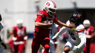 ason Bean #12 of the DC Defenders runs for a first down against the Orlando Storm