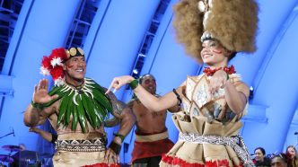 Dwayne Johnson and Catherine Lagaʻaia attend Disney’s Moana world premiere at the Hollywood Bowl in Los Angeles.