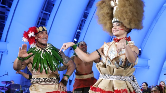 Dwayne Johnson and Catherine Lagaʻaia attend Disney’s Moana world premiere at the Hollywood Bowl in Los Angeles.